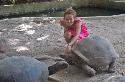 With tortoises in botanical garden, Mahe Seychelles