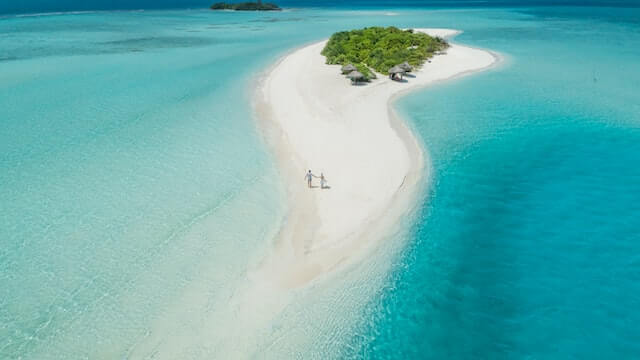 A couple walking on an island in the Maldives