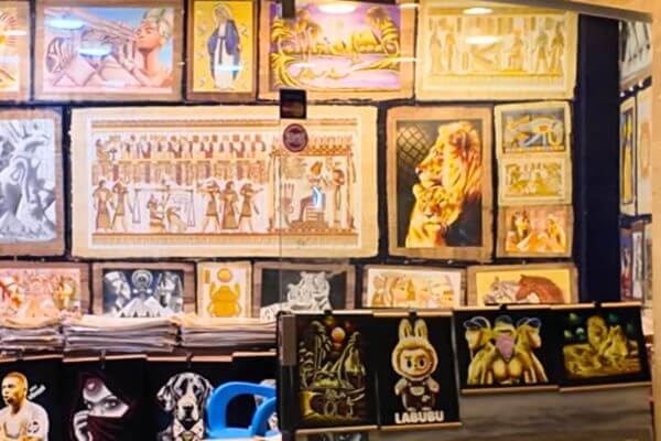 Papyrus in Egypt Papyrus paintings with ancient Egyptian scenes and figures on display for sale in a shop in Egypt.