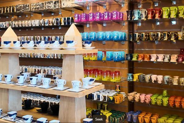 Pottery in Egypt Shelves of colorful ceramic mugs and cup sets on display in a shop in Egypt.