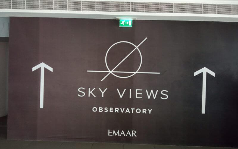 The sign for Sky Views Observatory Dubai on the way from metro