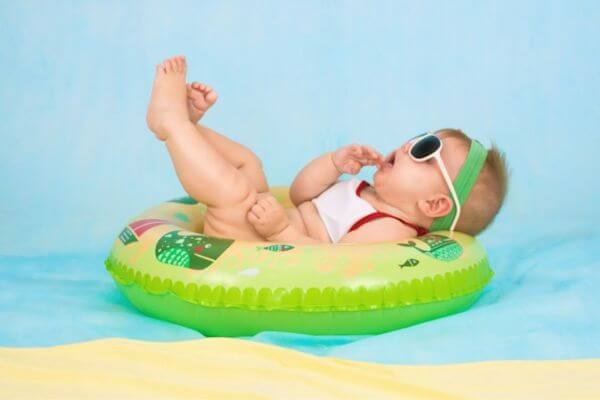 A baby floating on a swimming wheel