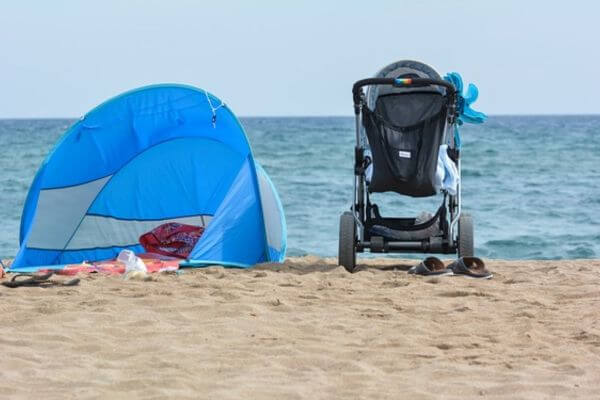 Baby stroller on the beach