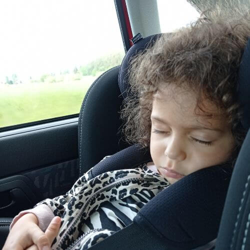 Sleeping baby in a car seat