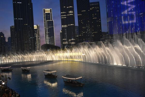 People on traditional Abra on Burj Khalifa Lake watching the Dubai Fountain Show