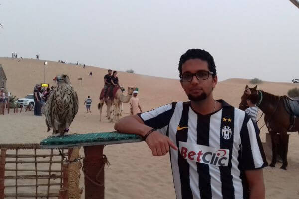 My husband taking a picture with a Falcon on the Dubai Desert Safari