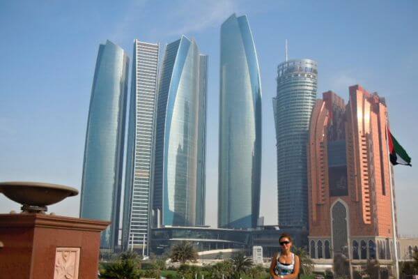 Me sitting in front of Emirates Palace with Etihad Towers in the background, Abu Dhabi