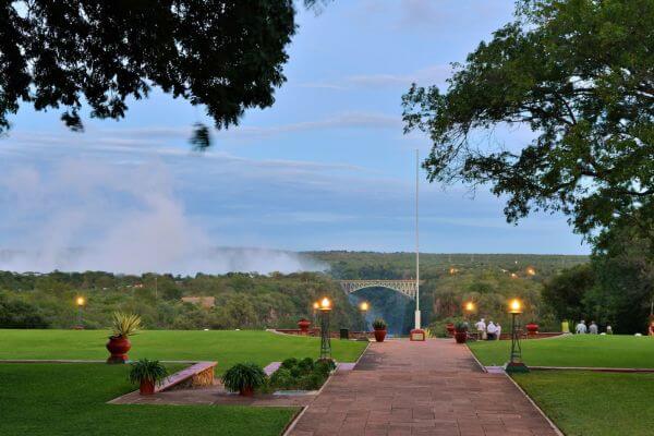 View of the Victoria Falls Bridge and the mist of the falls from the Victoria Falls Hotel in Zimbabwe