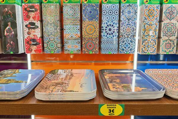 Andalusia, Trays Souvenir trays and coasters on display in a shop in Andalusia, with Moorish tile patterns and flamenco dancer prints.