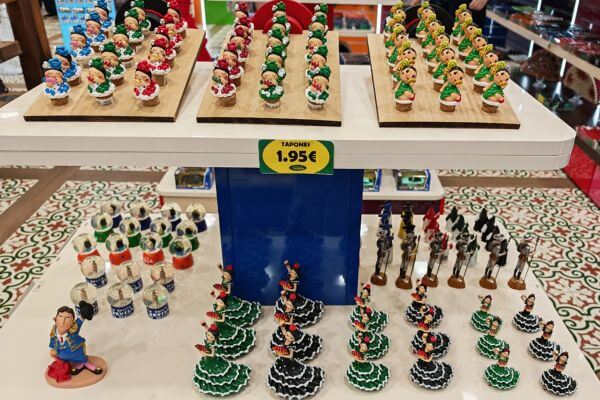 Andalusia, sculptures Small souvenir figurines on display in a shop in Andalusia, including flamenco dancers in colorful dresses and bottle stoppers.