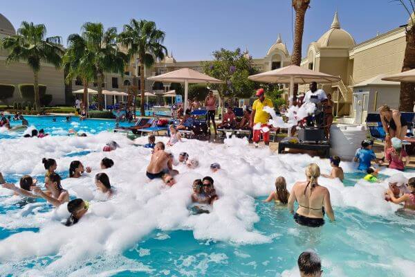 Foam party at Titanic Royal Guests enjoying a foam party in the pool at Titanic Royal Resort in Hurghada, Egypt.