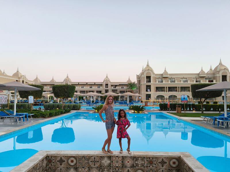A woman and a young girl standing by the pool at an all-inclusive resort in Hurghada, Egypt.